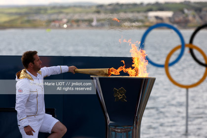 .LONDON 2012 - OLYMPIC GAMES - SAILING - WEYMOUTH (ENG) - 27 07 to 12 08 2012 - 28 07 2012 - BEN AINSLIE (BGR) LIGHTED ON THE OLYMPIC FLAME IN WEYMOUTH